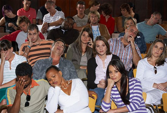 600-01195616 © Masterfile Model Release: Yes Property Release: Yes Model & Property Release Bored People in Auditorium Seats